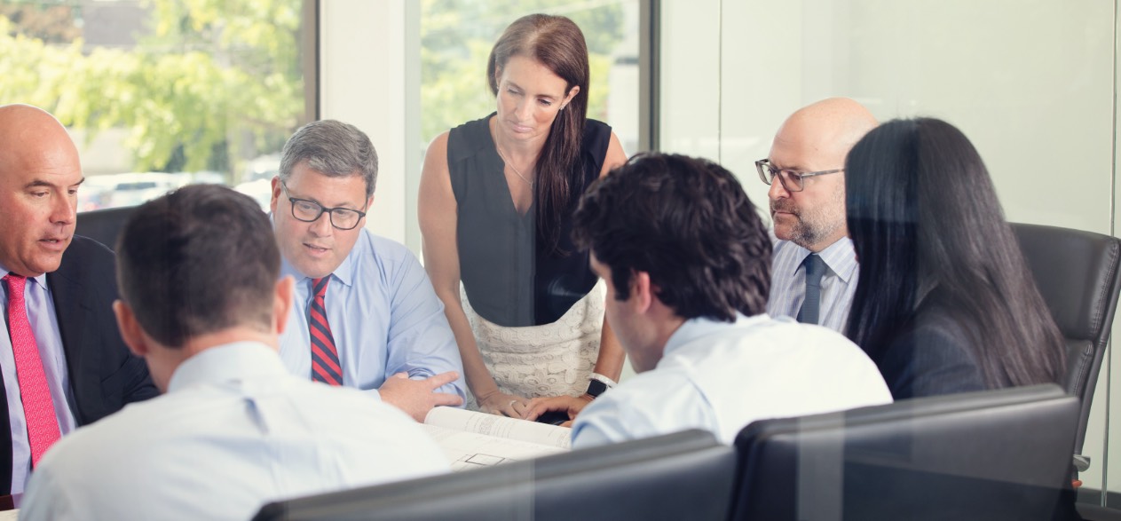 Knighthead Funding team sitting at a conference table